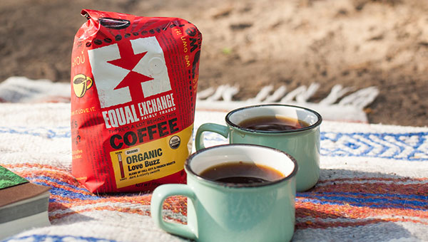 Coffee and mug on a picnic blanket