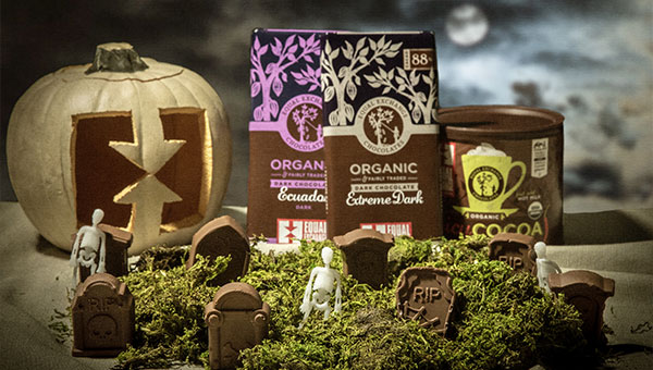Chocolate bars and cocoa with a spooky Halloween graveyard scene including chocolate gravestones
