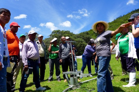 Joselinda Manueles of COMSA Co-operative in Honduras explains her irrigation system to participants in one of the grant's productivity exchanges